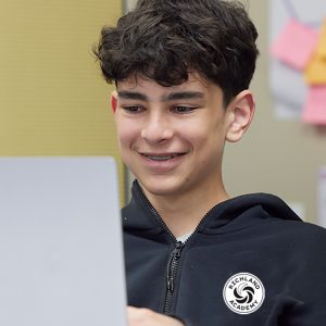 senior boy working on laptop